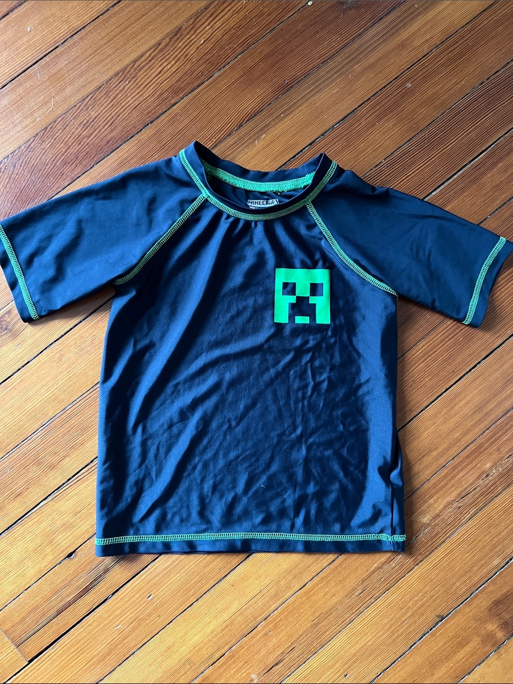 Kids Black Rash Guard Swim Shirt with Green Accents